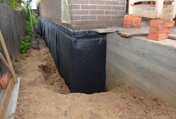 SJ Waterproofing Pros technician performing targeted Waterproofing assessment in Aniwa, WI
